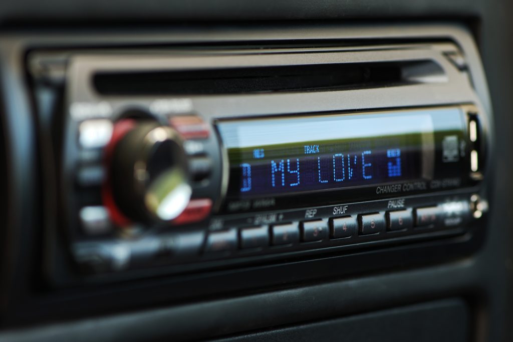 Black audio car control panel with "my love" blue writings.